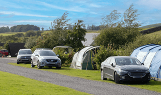 Grass trailer tent pitches with electric